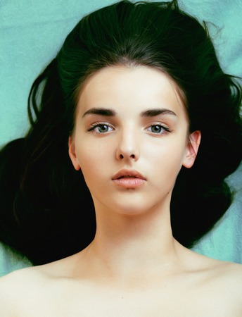 young pretty woman with hairstyle close up, fresh brunette の写真素材