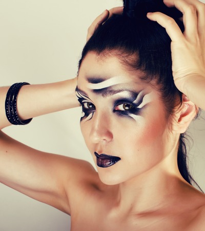 beauty young woman with creative make up like zebra closeupの写真素材