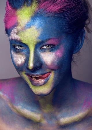 beauty woman with creative make up like Holy celebration in India close upの写真素材