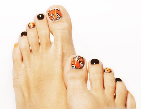 pedicure with butterfly design isolated on white studioの写真素材