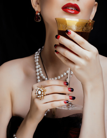 beauty stylish redhead woman with hairstyle and manicure wearing jewelryの写真素材