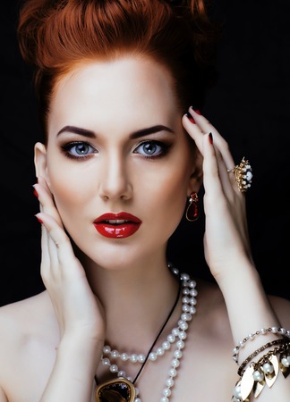 beauty stylish redhead woman with hairstyle and manicure wearing jewelry, qween gingerの写真素材