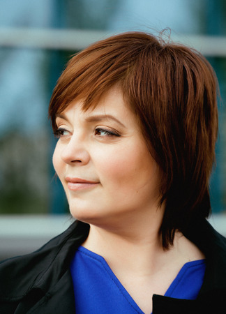 beauty brunette mature woman outside, business people at work smiling closeupの写真素材