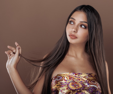 cute happy young indian real woman in studio close up smiling, fashion mulattoの写真素材