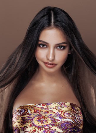 cute happy young indian real woman in studio close up smiling, fashion mulattoの写真素材