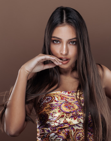 cute happy young indian real woman in studio close up smiling, fashion mulattoの写真素材