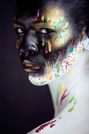 woman with creative make up closeup like drops of colorsの写真素材