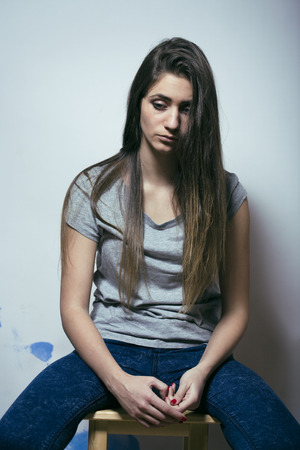 problem depressioned teenage with messed hair and sad face, junkyの写真素材