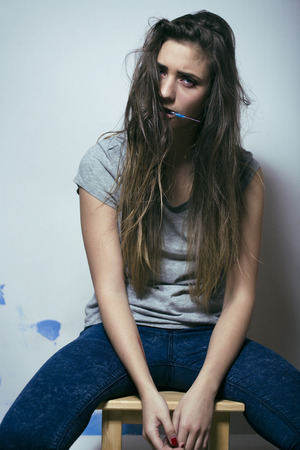 problem depressioned teenage with messed hair and sad face, junkyの写真素材