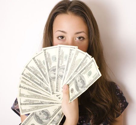 portrait of pretty young woman with money, isolated on white background, dolars cashの写真素材