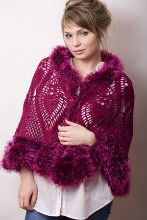 young real woman with wrap in studio on white backgroundの写真素材