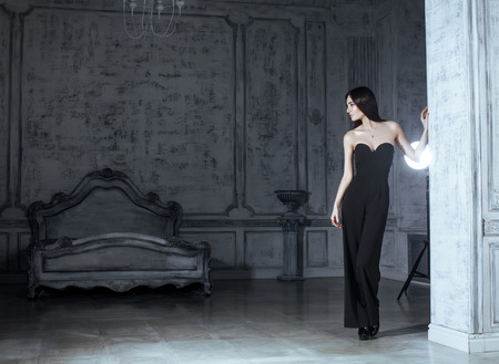 beauty young brunette woman in luxury home interior, fairy bedroom grey stylishの写真素材