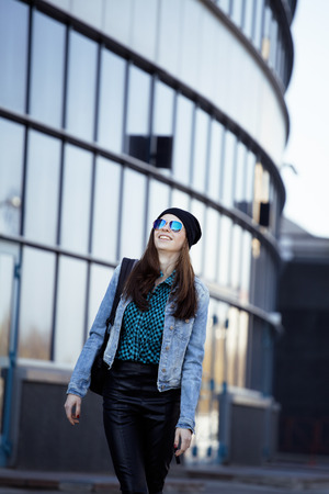 young pretty girl near business building walking, student in america or europeの写真素材