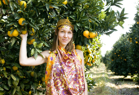 pretty islam woman in orange grove smiling, real muslim girl smilingの写真素材