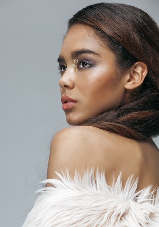young beauty african american mulatto woman with fashion make up, emothional face closeupの写真素材