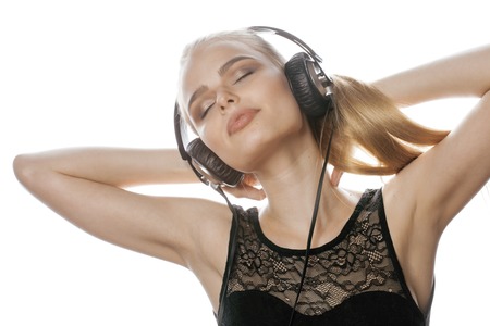 young sweet talented teenage girl in headphones singing isolatedの写真素材