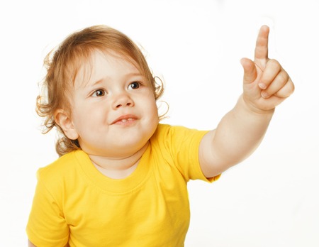 little cute baby girl pointing isolated on white close upの写真素材