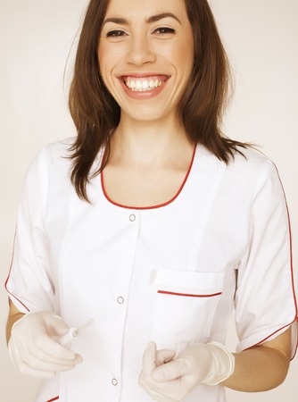 young pretty woman doctor with stethoscope close upの写真素材
