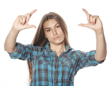 cute teenage girls making selfie isolated on whiteの写真素材