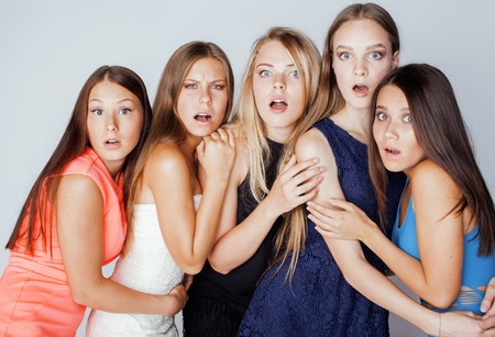 many girlfriends hugging celebration on white background, smiling talking chatの写真素材