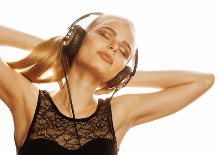young sweet talented teenage girl in headphones singing isolated close upの写真素材