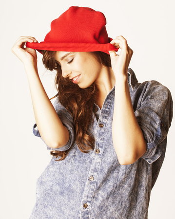young cheerful brunette teenage girl on white background smilingの写真素材