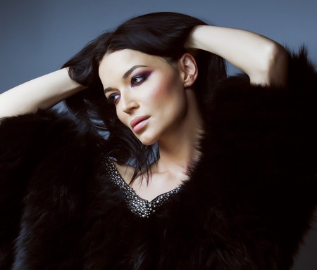 young pretty brunett woman dressed stylish in fur close up luxury seductive wealthの写真素材