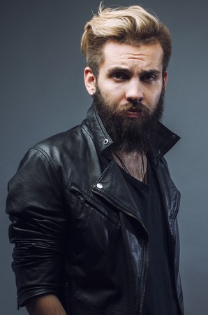 young attractive bearded hipster manの写真素材