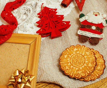 christmas card wooden vintage with handmade gifts, toys, cookie, snowman, santaclaus, button heart warm winter homeの写真素材