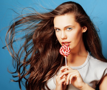 young pretty adorable woman with candy close up like doll makeupの写真素材