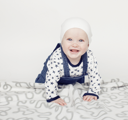 little cute baby toddler on carpet isolated close up smiling, adorable kid
