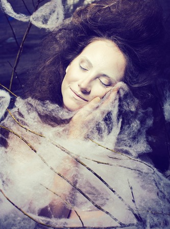 beauty woman with creative make up like cocoon, scary halloween celebrationの写真素材