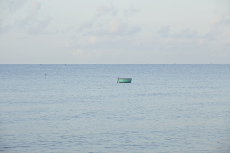 one lonely fisherman boat in sea asian vietnamese style, mui neの写真素材