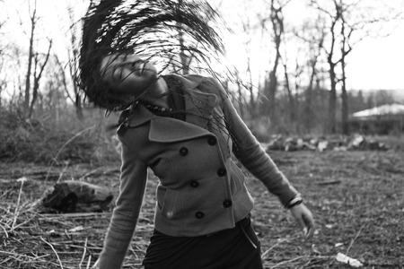 Young cute smiling real stylish dressed woman in green palm park smiling, resting, enjoing, lifestyle outside conceptの写真素材