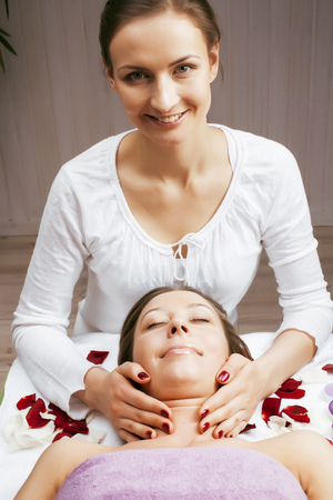 stock photo attractive lady getting spa treatment in salon, massage doctor smiling care pretty cureの写真素材