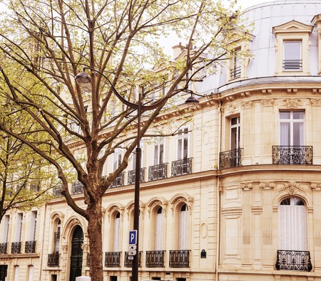 houses on french streets of Paris. citylife concept. spring warm sunlightの写真素材