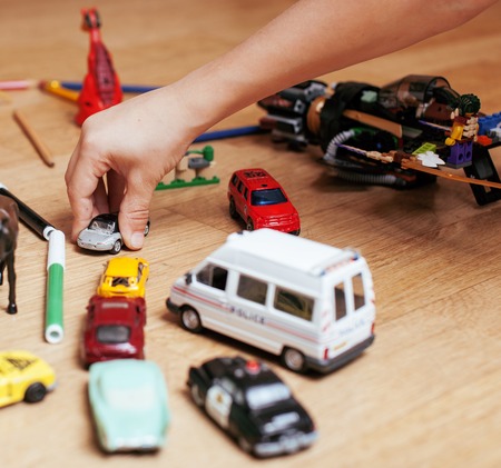 children playing toys on floor at home, little hand in mess, free education, lifestyle people conceptの写真素材
