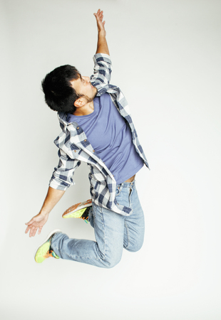 young pretty asian man jumping cheerful against white background, lifestyle people concept, supeman...