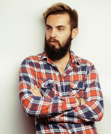 portrait of young bearded hipster guy smiling on white background close up, brutal modern manの写真素材