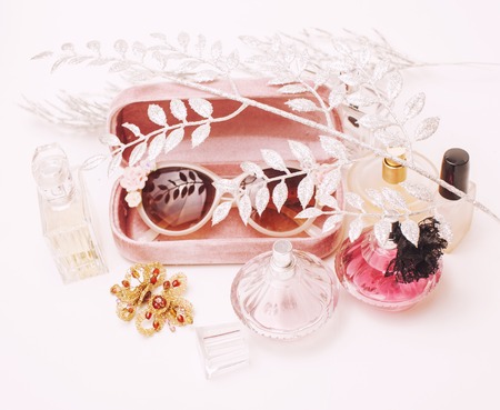 Jewelry table with lot of girl stuff on it, little mess in cosmetic brushes, women interior concept,...