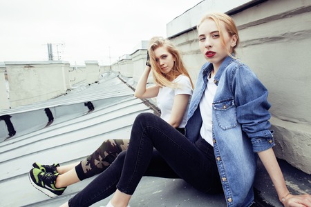 two blonde real teenage girl hanging out at summer together best friends, lifestyle people concept close upの写真素材