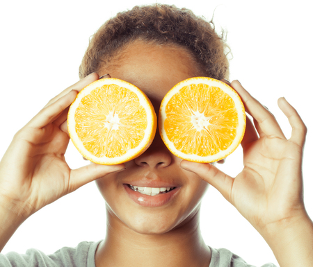 young smiling afro american woman with half oranges, lifestyle concept isolated on white backgroundの写真素材