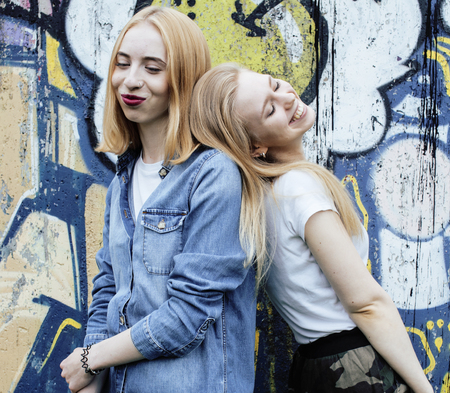 two blonde real teenage girl hanging out at summer together best friends, lifestyle people conceptの写真素材