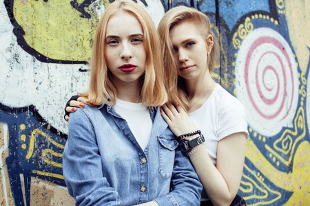 two blonde real teenage girl hanging out at summer together best friends, lifestyle people concept close upの写真素材