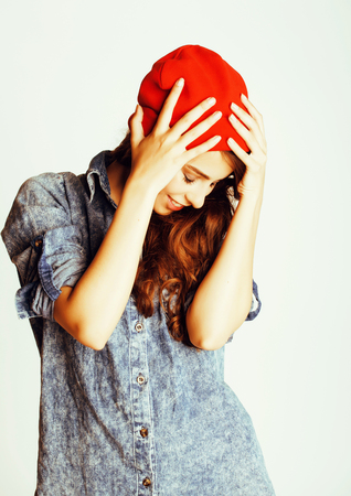 young cheerful brunette teenage girl on white background smilingの写真素材