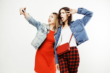 best friends teenage girls together having fun, posing emotional on white background, besties happy smiling, lifestyle people concept close upの写真素材