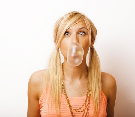 young pretty stylish hipster blond girl posing emotional isolated on white background happy smiling cool smile, lifestyle people concept close upの写真素材