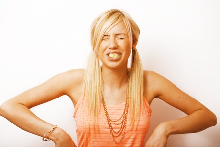 young blond woman posing emotional in studio isolated on white background, lifestyle people concept close upの写真素材