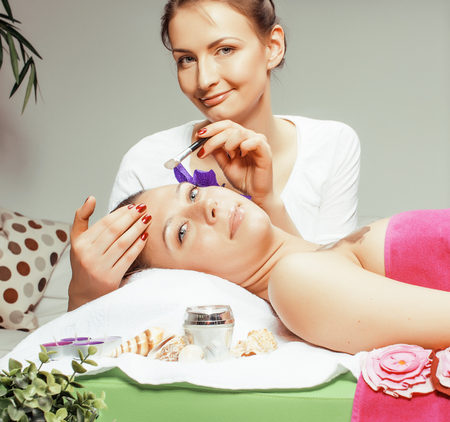 stock photo attractive lady getting spa treatment in salon, healthcare people concept close upの写真素材
