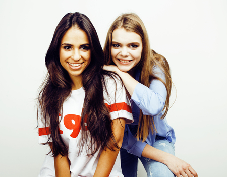 best friends teenage girls together having fun, posing emotional on white background, besties happy...